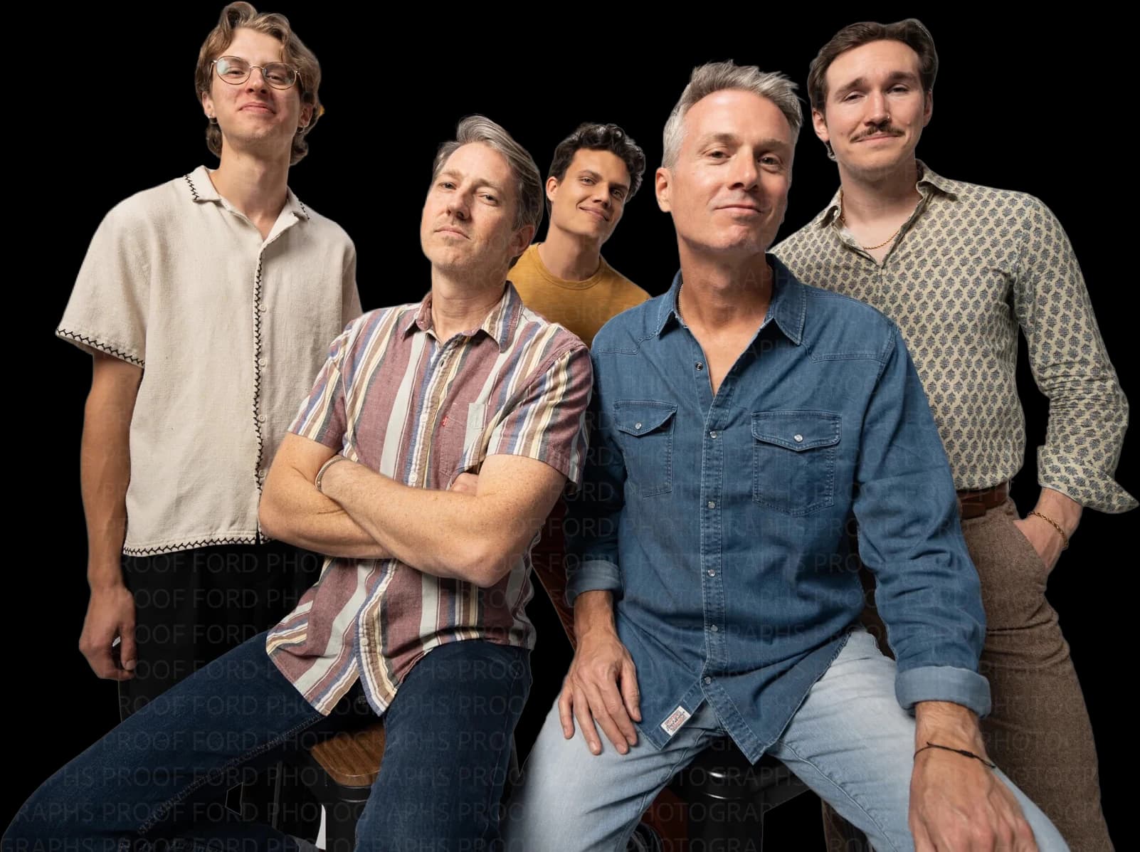 The five members of The Swell posing together in a photography studio