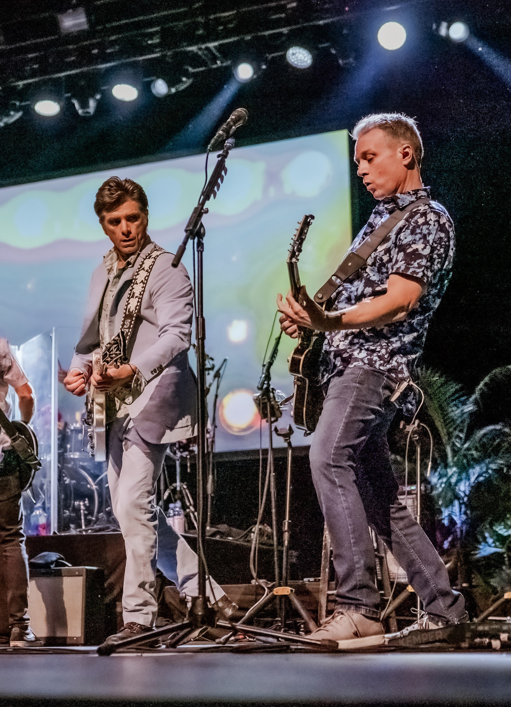 Brian Eichenberger and John Stamos playing guitars together onstage